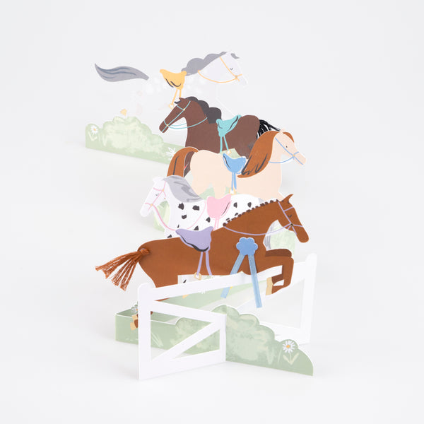 Our horse birthday card features horses, ribbons, tassels and a jump, and makes a great decoration for a horse party. Image4