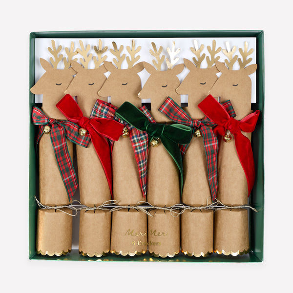 Our no-snap Christmas crackers feature reindeer with bow details in tartan and velvet, with a joke, party hat and small gift inside. Image1