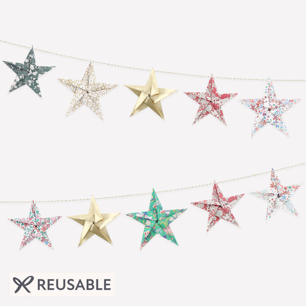 Let our star garland, designed with joyful Liberty star and floral prints and gold foil details, add an elegant touch to your Christmas décor. Image1