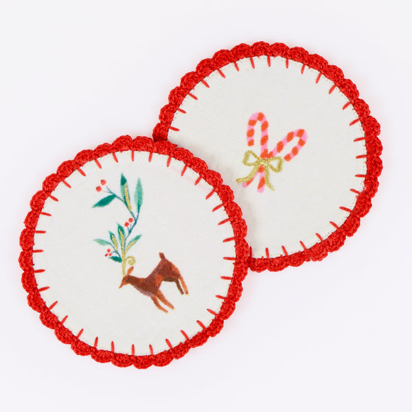 Our fabric cocktail napkins for Christmas are made with a linen and cotton blend, festive motifs, red crochet borders and gold embroidery. Image3