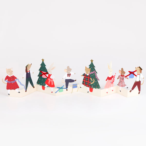 Our Christmas card for kids features animals around the Christmas tree and embellished gifts, opens out for an adorable display. Image1
