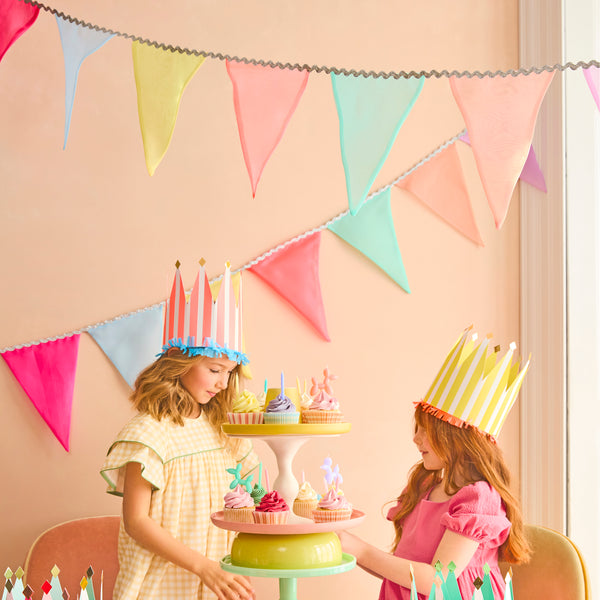 Our rainbow garland is ideal to add charm and colour to any celebration, made with organza flags in 8 colours it's reusable and decorative. Image2