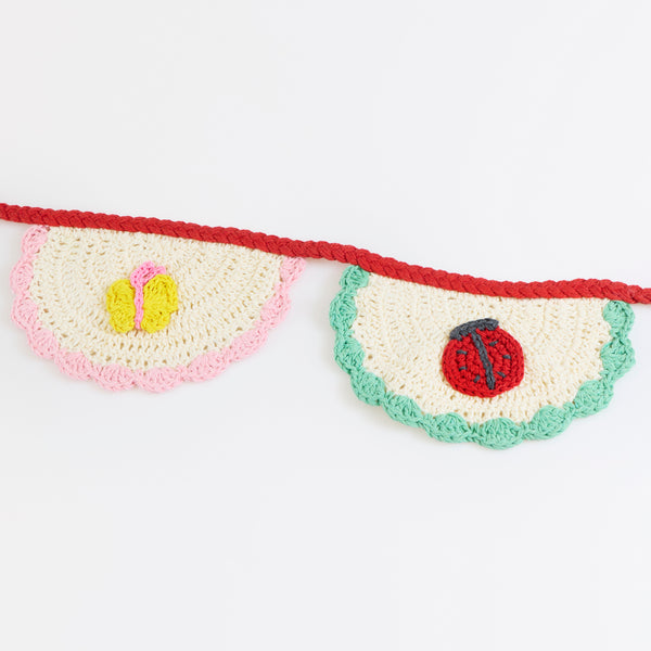 Our crochet garland features scalloped pennants with colourful designs, presented in an organza drawstring bag, a beautiful decoration. Image3