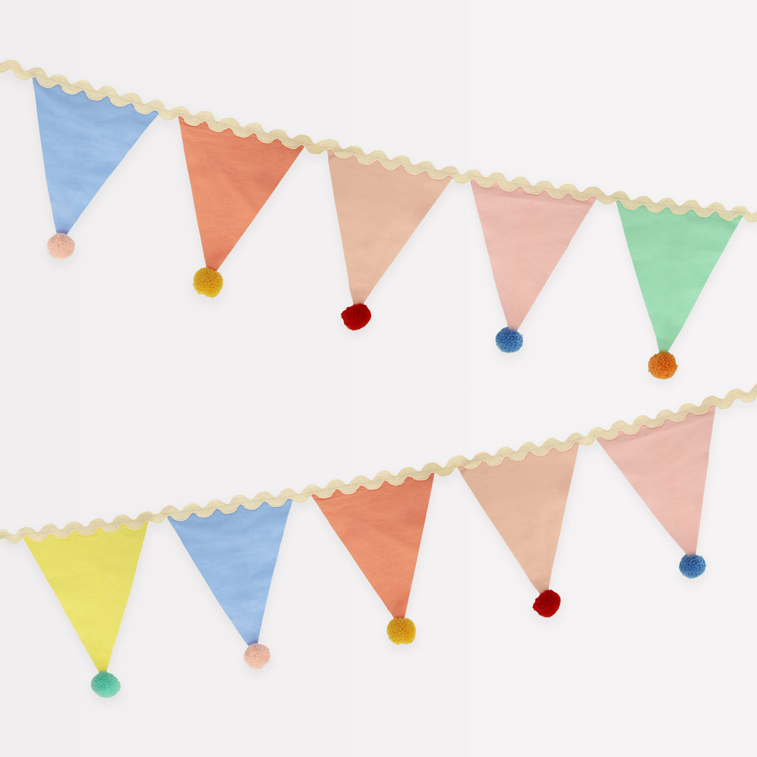 Add a pop of pastel colour to your party table or wall with our flag garland with pompoms.