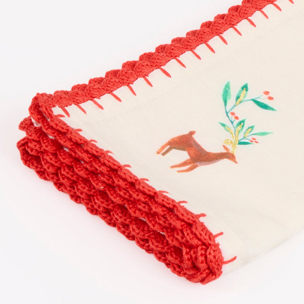 Our Christmas fabric napkins are made from an ivory linen and cotton blend, with festive motifs, embroidered details and crochet borders. Image4