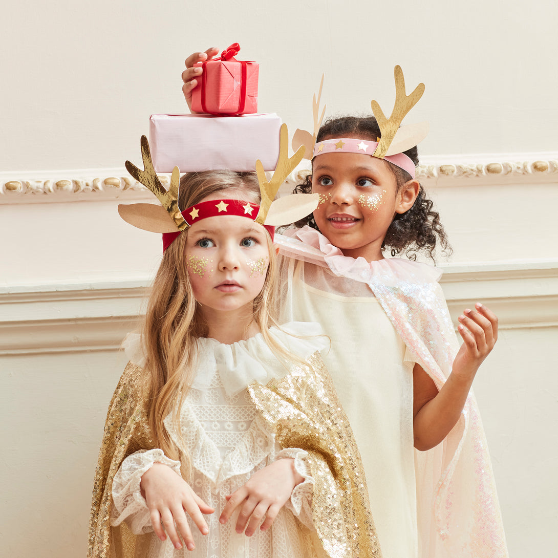 Our antler headbands, with velvet bands, shiny gold stars and antlers, and reindeer ears, make fun Christmas headwear.