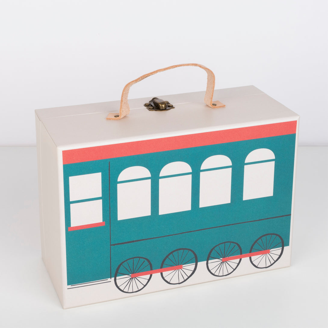 This kids advent calendar is presented in a mini suitcase which contains wooden trains.