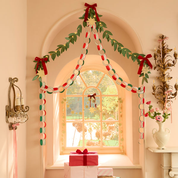 Our set of Christmas hanging decorations includes paper chain links to make a paper chain, a foliage garland and a bow and star decoration. Image2