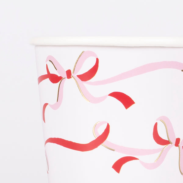 Our Christmas party cups, with a stylish bow design in red, pink and gold are ideal for festive drinks and table decoration. Image3