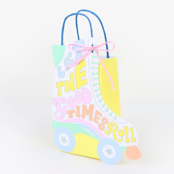 Our party bags, in a fun roller skate shaped design, feature paper based raffia bows, twisted paper handles, and lots of groovy colours. Image3