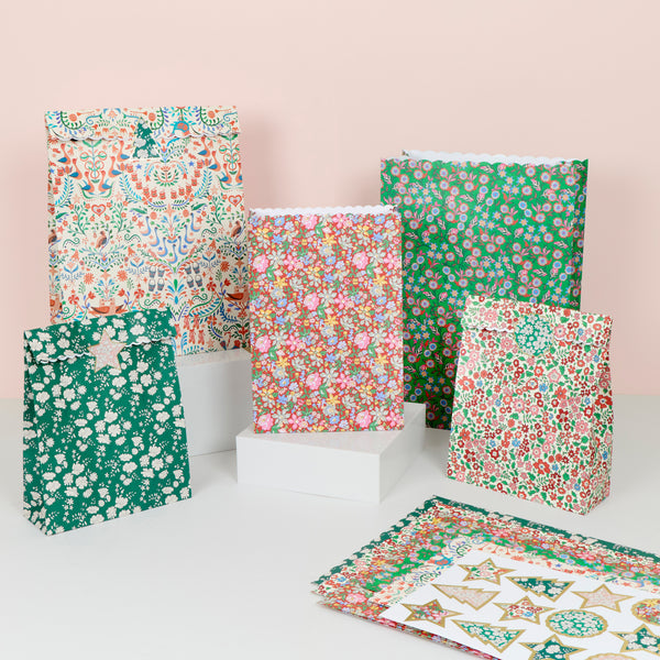 Our paper Christmas gift bags feature beautiful Liberty print designs for an elegant look, with  five designs in two sizes. Image1