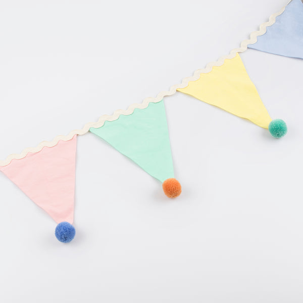 Add a pop of pastel colour to your party table or wall with our flag garland with pompoms. Image4