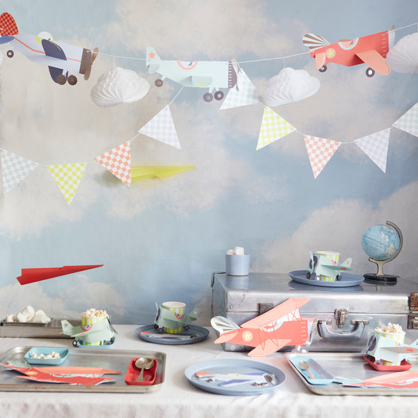 Our paper cups have a plane sleeve that fits over the cups, ideal for a plane party. Image2