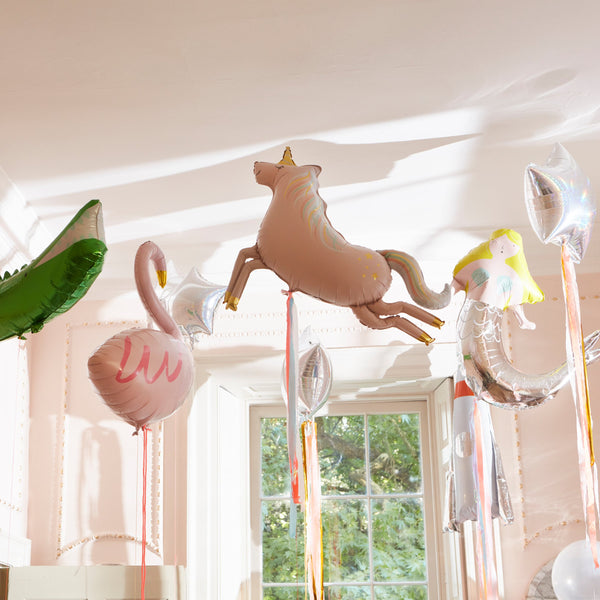 The unicorn balloon has printed foil details, a neon cord to hang it up with, and beautiful streamers for a special touch. Image3