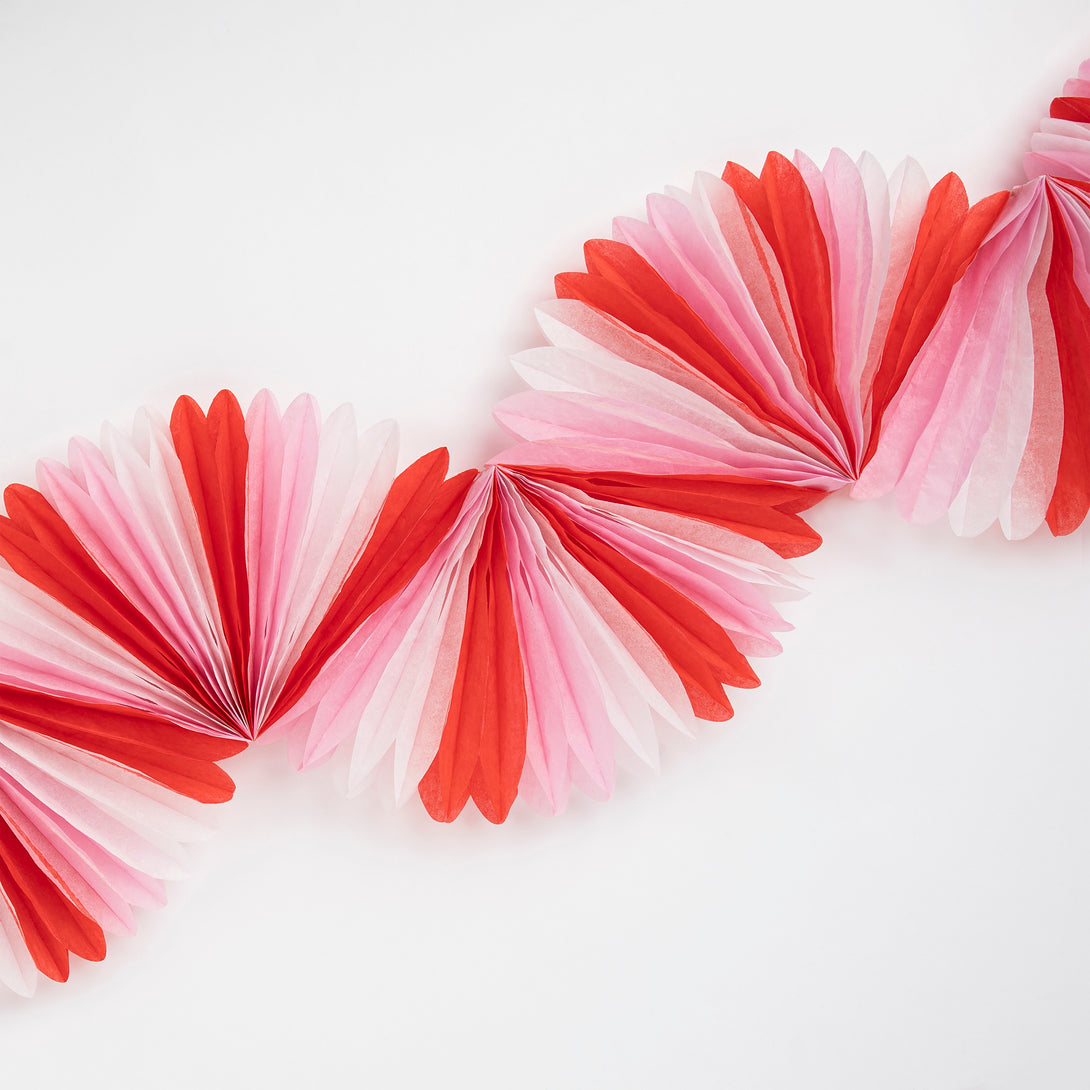 Our honeycomb garland is designed to look like a candy cane decoration, perfect to add to your Christmas party supplies.
