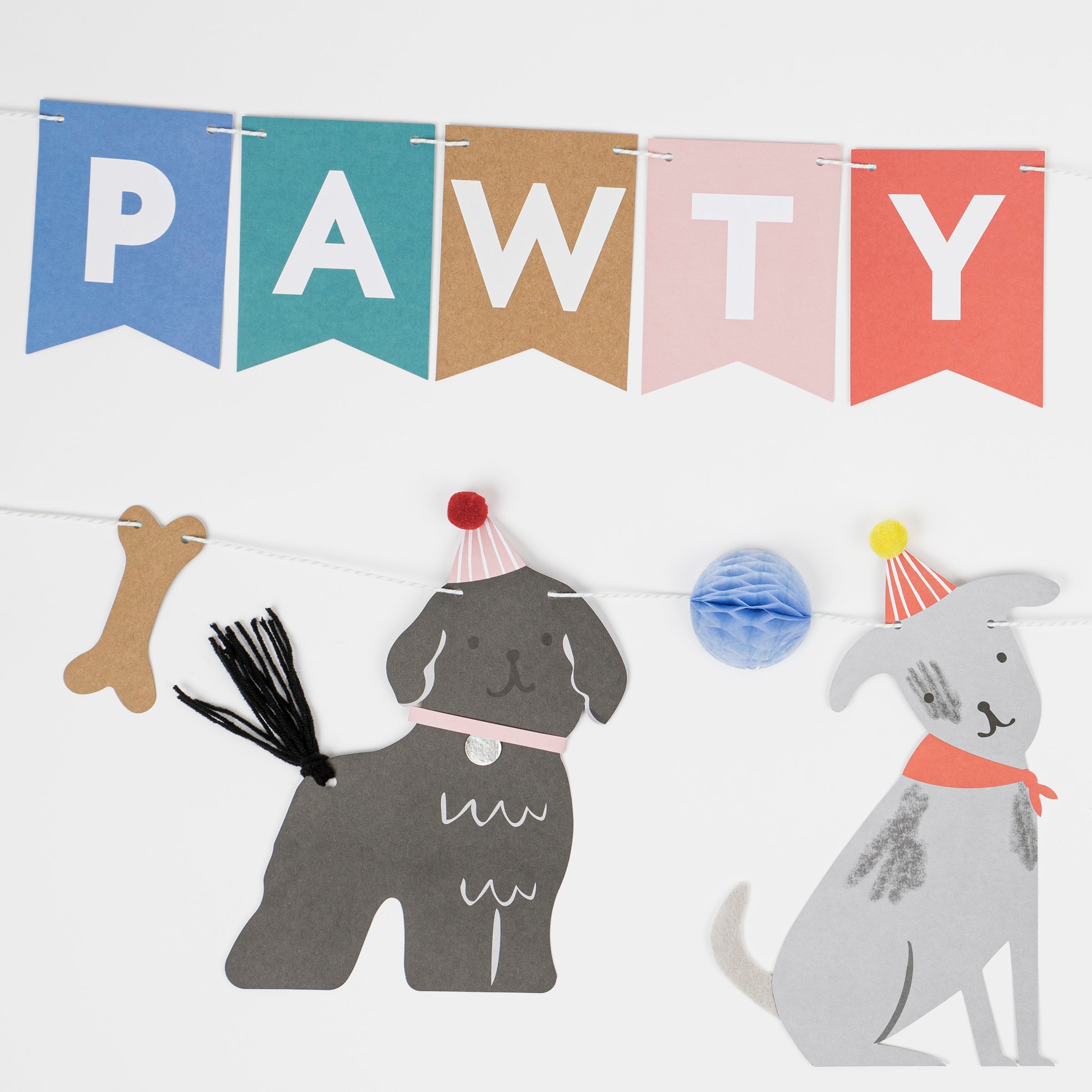 This adorable paper garland, featuring dogs, is perfect for a dog's birthday party or a dog themed party.