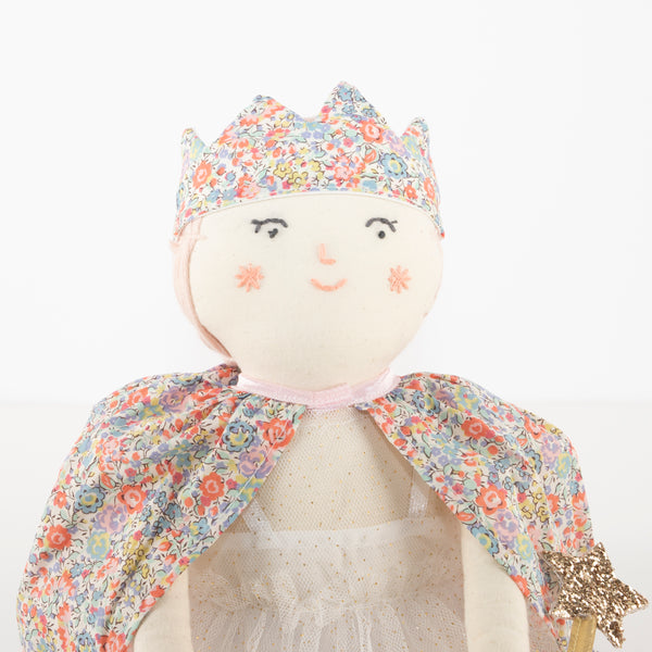 This beautiful princess doll has a white tulle dress with a Liberty floral cape, a crown and a star wand. Image4