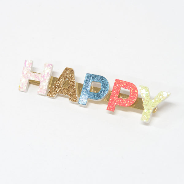 Our gold hair clip features the word "Happy" in leatherette and glitter lettering. Image3