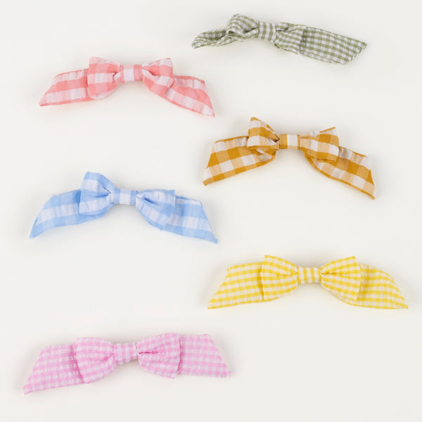 Our stylish kids gold hair clips, with gingham bows, make wonderful kids hair accessories. Image2