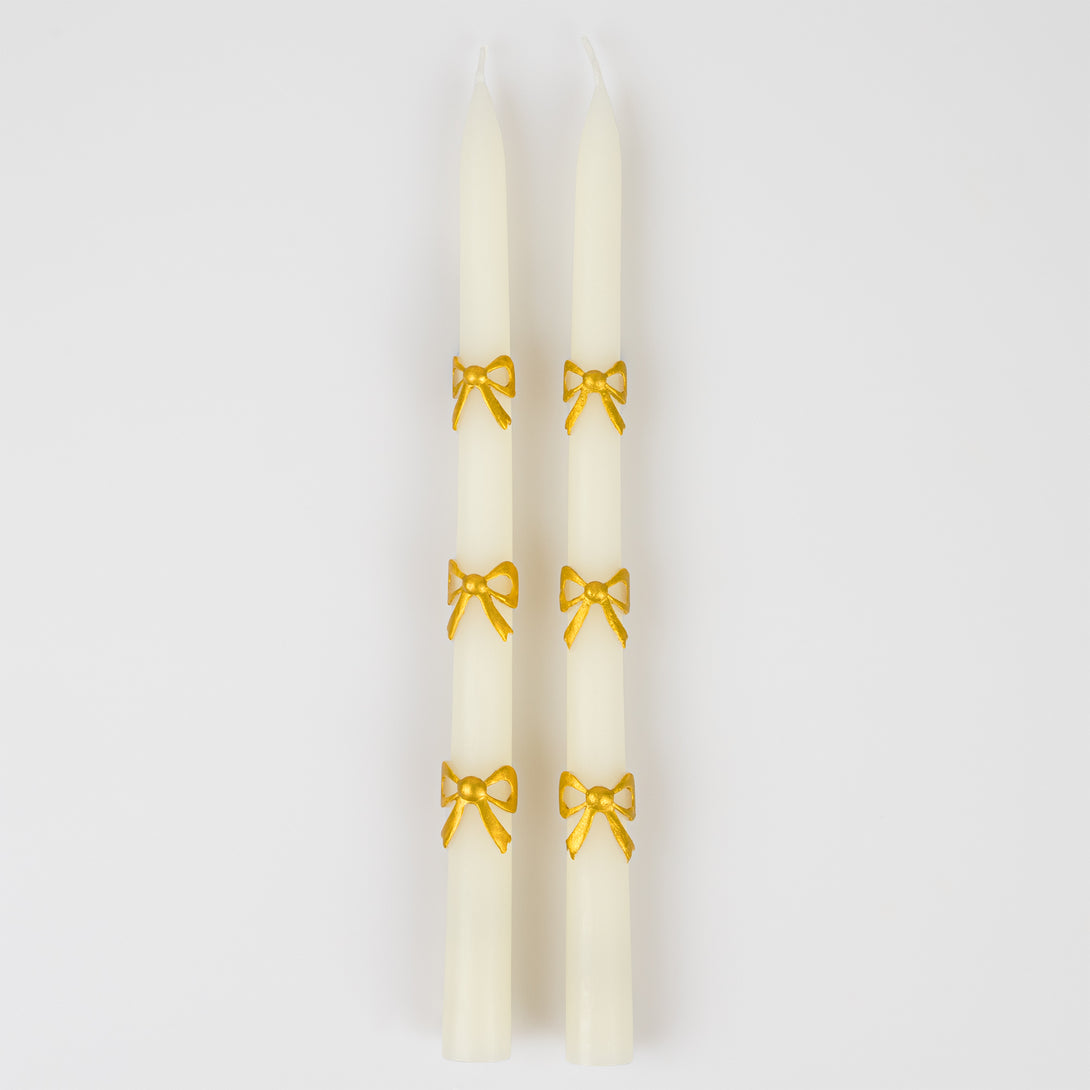 Our taper candles, with a bow design, are perfect as Christmas decorative candles.