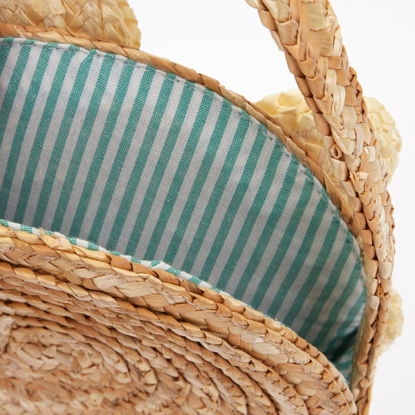 This sensational straw kids bag has a raffia daisy with a yellow pompom in the centre. Image3