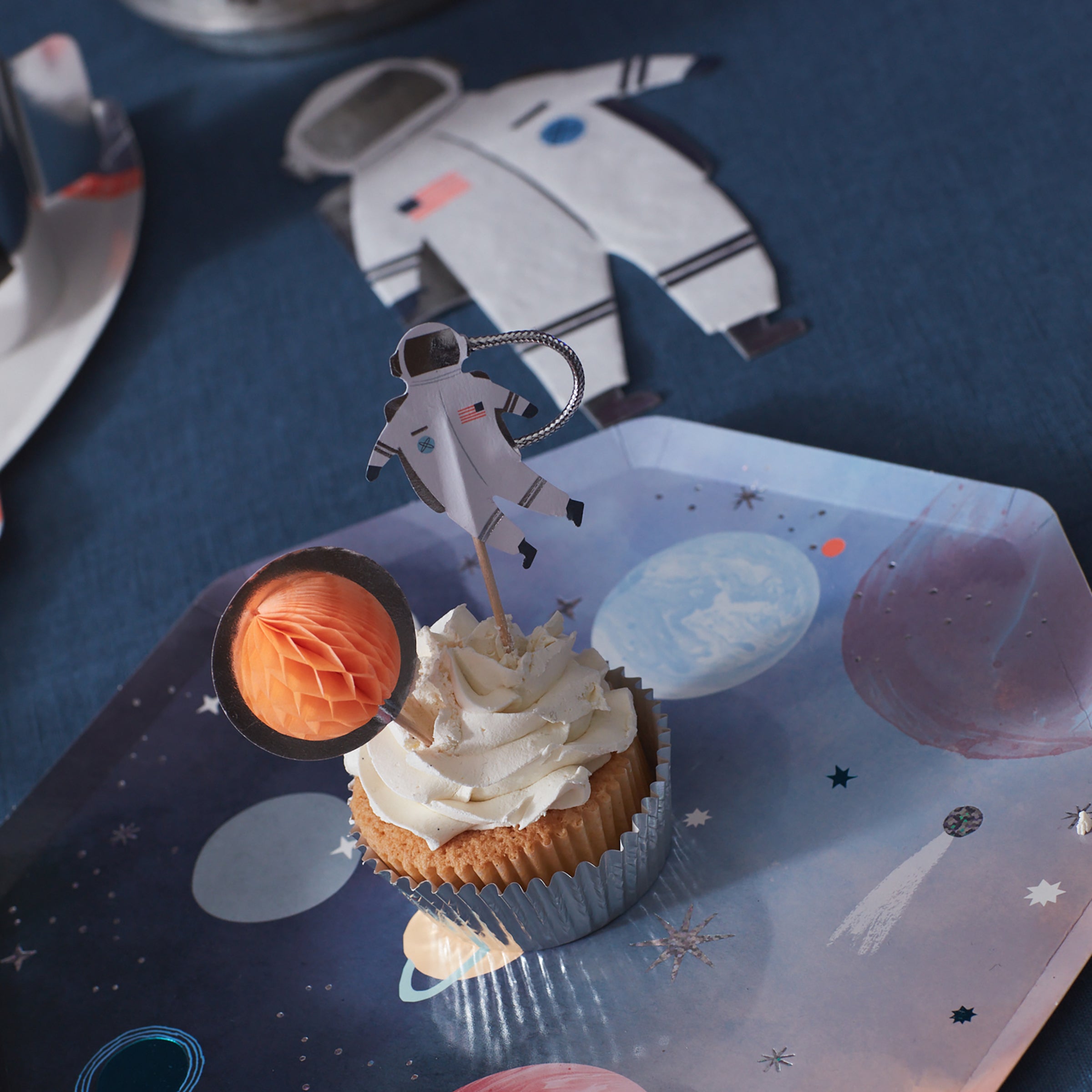This special cupcake set features 24 cake toppers and 24 cupcake cases perfect for a space party.