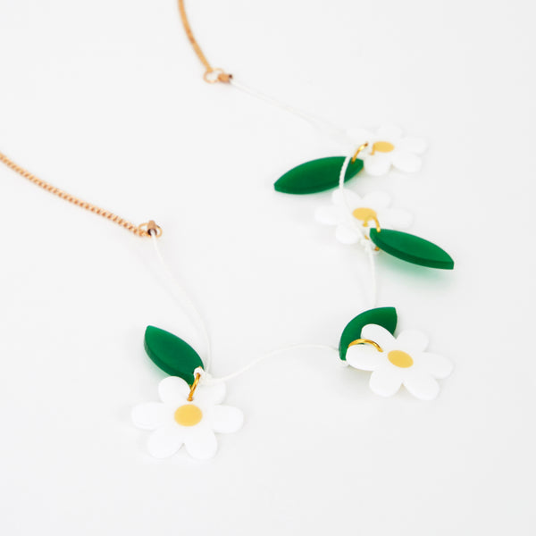 Our colourful daisy necklace is crafted from acrylic with a gold tone chain. Image3