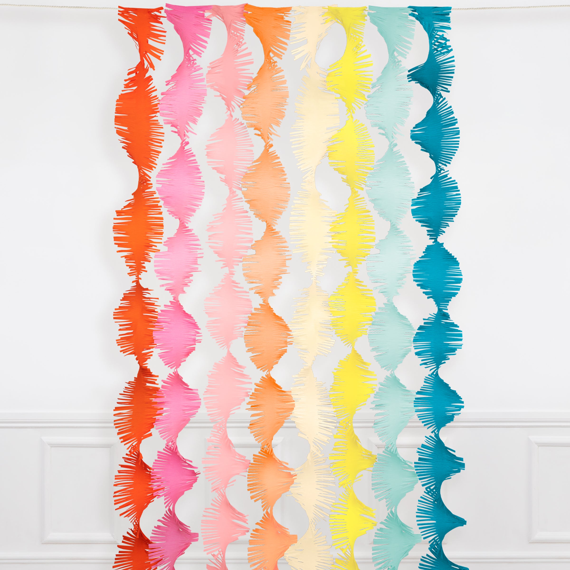 Our party backdrop is crafted from paper streamers in 8 colours.