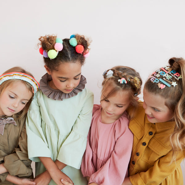 Our gold hair clip features the word "Happy" in leatherette and glitter lettering. Image6