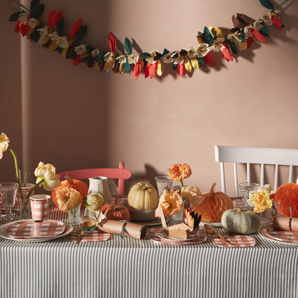 This paper flower garland, with paper leaves, makes a stunning autumn party decoration idea. Image2
