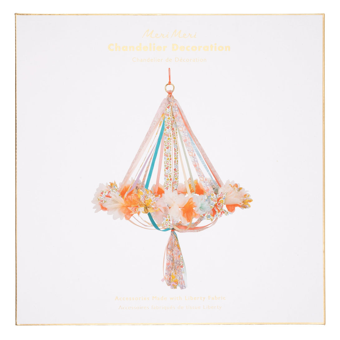 This hanging flower decoration is made from colourful fabric with streamers.