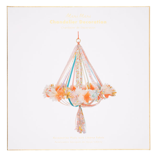This hanging flower decoration is made from colourful fabric with streamers. Image4