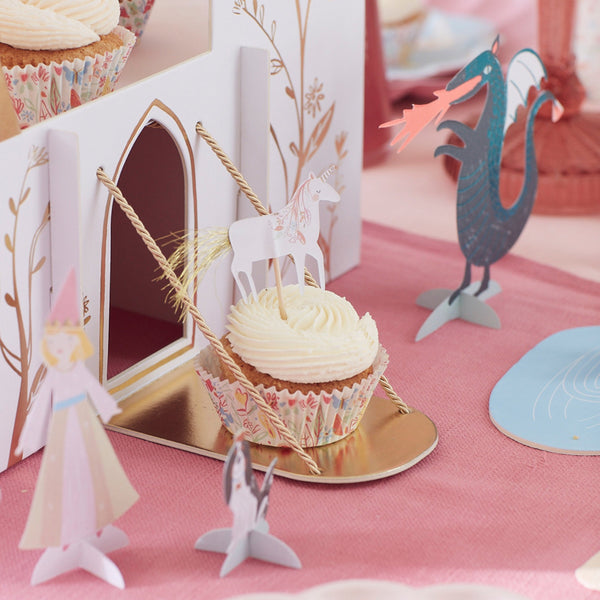 This princess cupcake kit includes carriage, flower, castle and unicorn cake toppers and coordinating cupcake cases. Image1