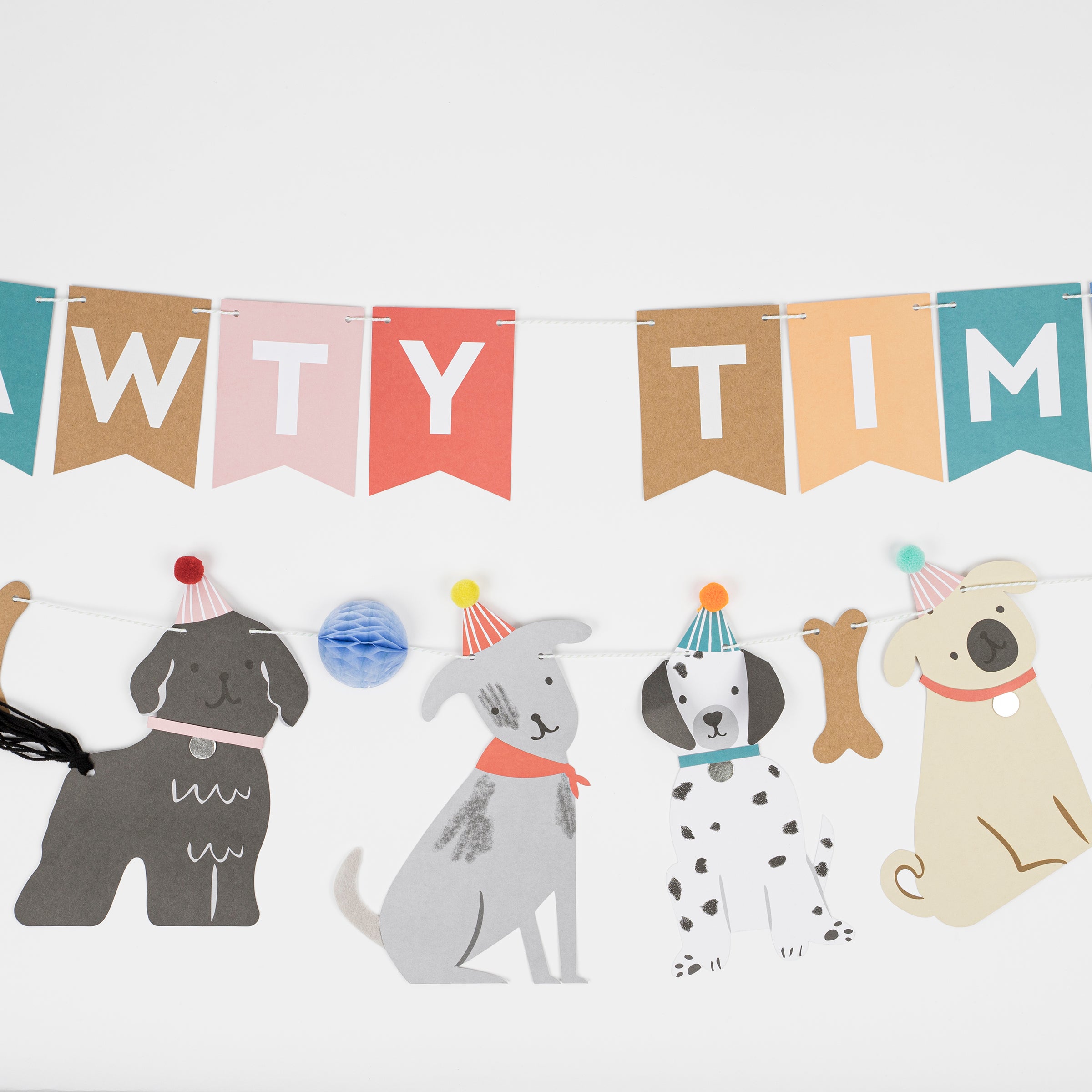 This adorable paper garland, featuring dogs, is perfect for a dog's birthday party or a dog themed party.