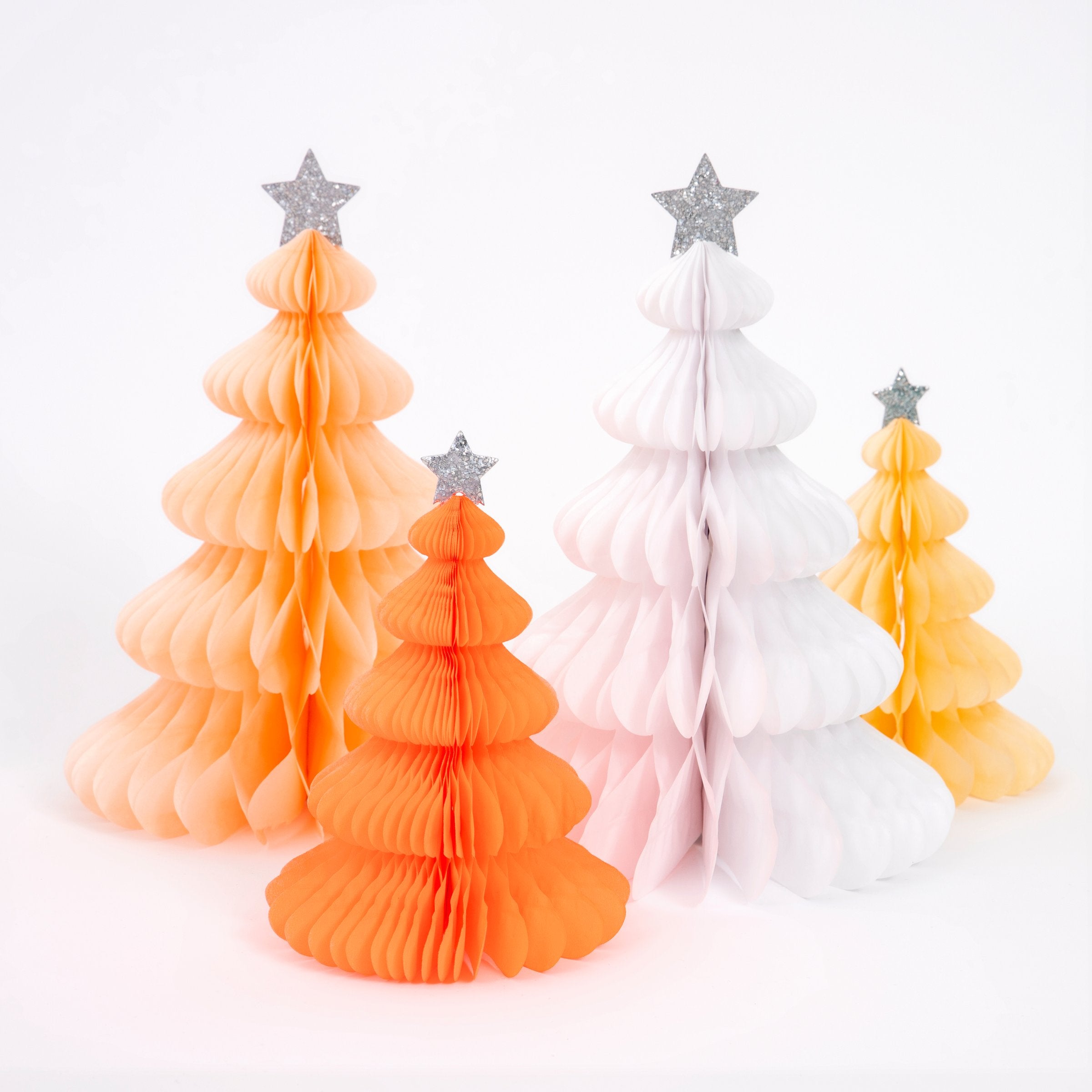 These beautiful honeycomb decorations are made from tissue paper with shining silver stars on top.