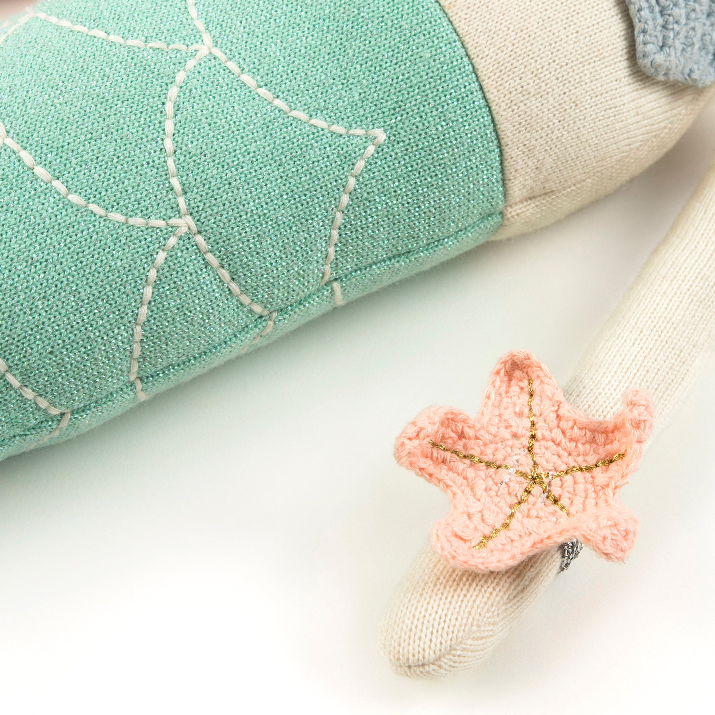 Our mermaid toy is a cotton toy with beautiful embellishments.