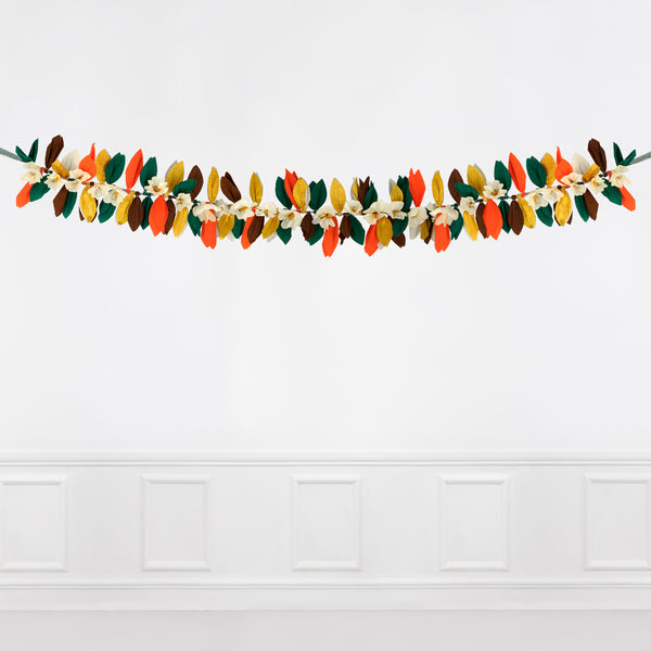 This paper flower garland, with paper leaves, makes a stunning autumn party decoration idea. Image3