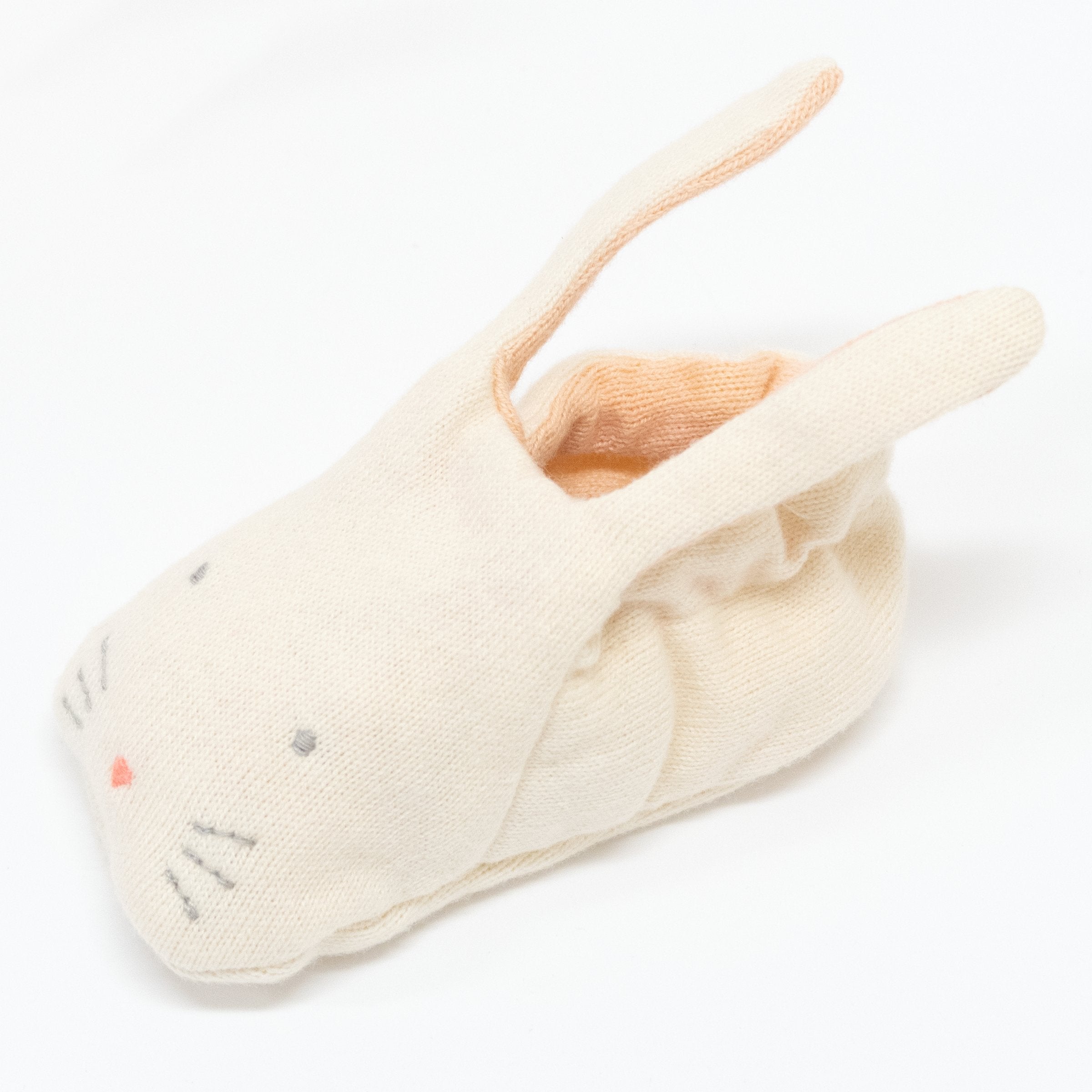 These adorable bunny booties are crafted from knitted organic cotton, with a peach lining, stitched features and floppy ears.