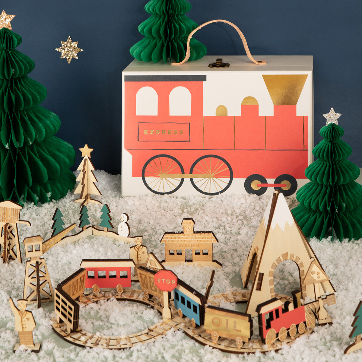 This kids advent calendar is presented in a mini suitcase which contains wooden trains.