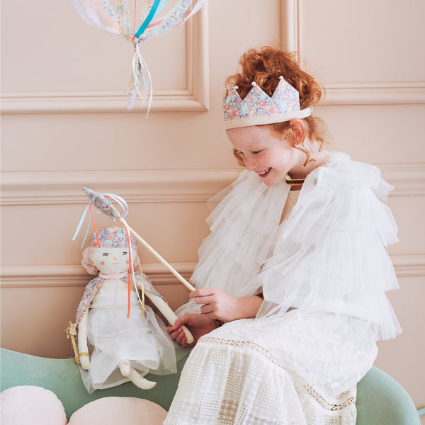 This beautiful princess doll has a white tulle dress with a Liberty floral cape, a crown and a star wand. Image2