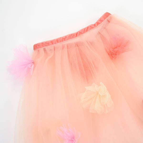 Our kids cape is crafted from tulle with tulle flower embellishments. Image5