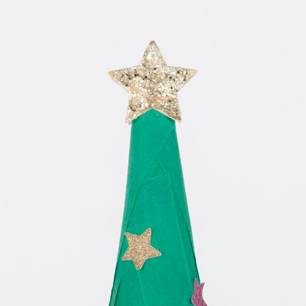This surprise ball, in the shape of a Christmas tree, contains a necklace, gold party hat, temporary tattoos for kids and stickers for kids. Image3