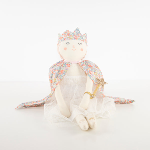 This beautiful princess doll has a white tulle dress with a Liberty floral cape, a crown and a star wand. Image3