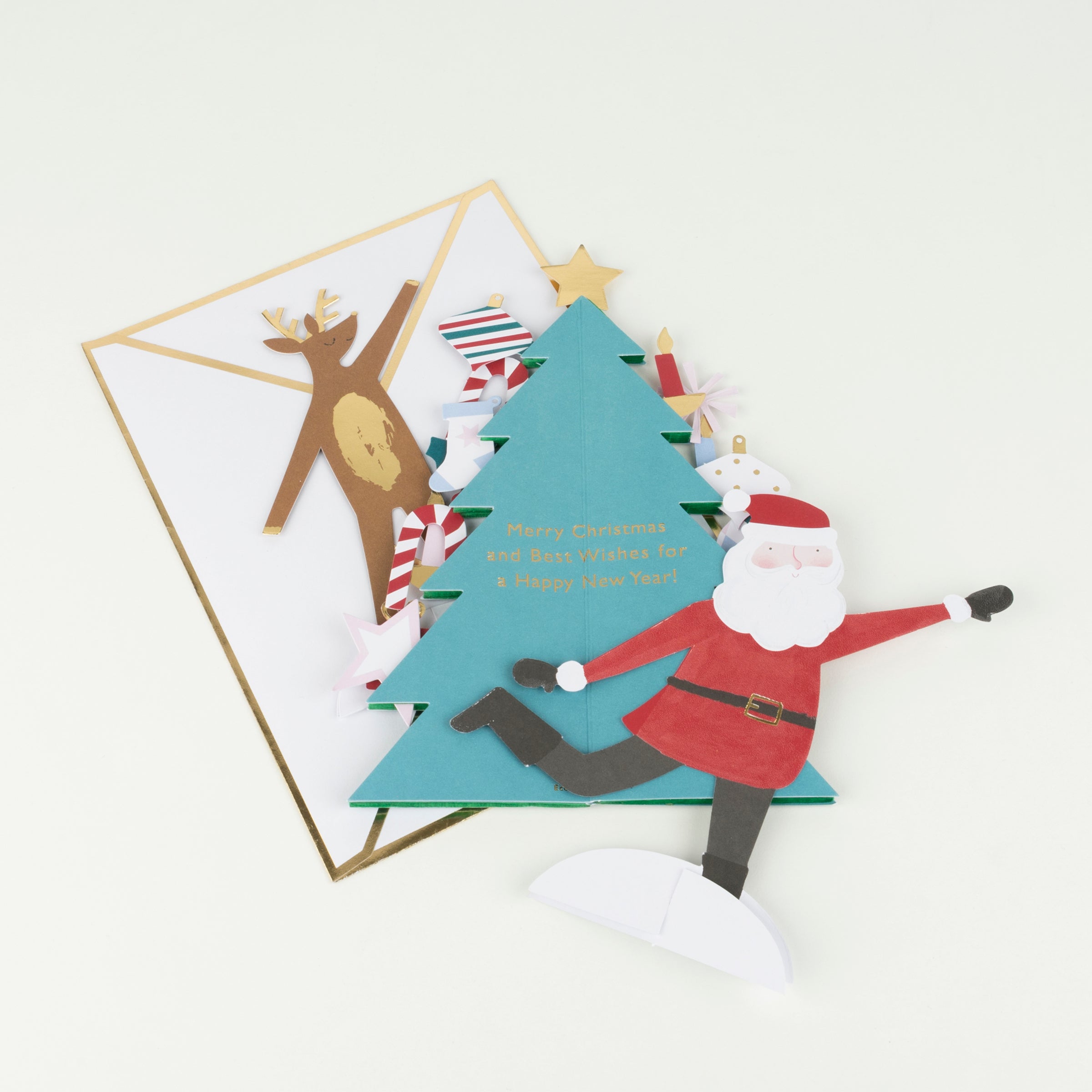 This 3D Christmas card features a honeycomb Christmas tree with Santa, and lots of shiny gold foil.