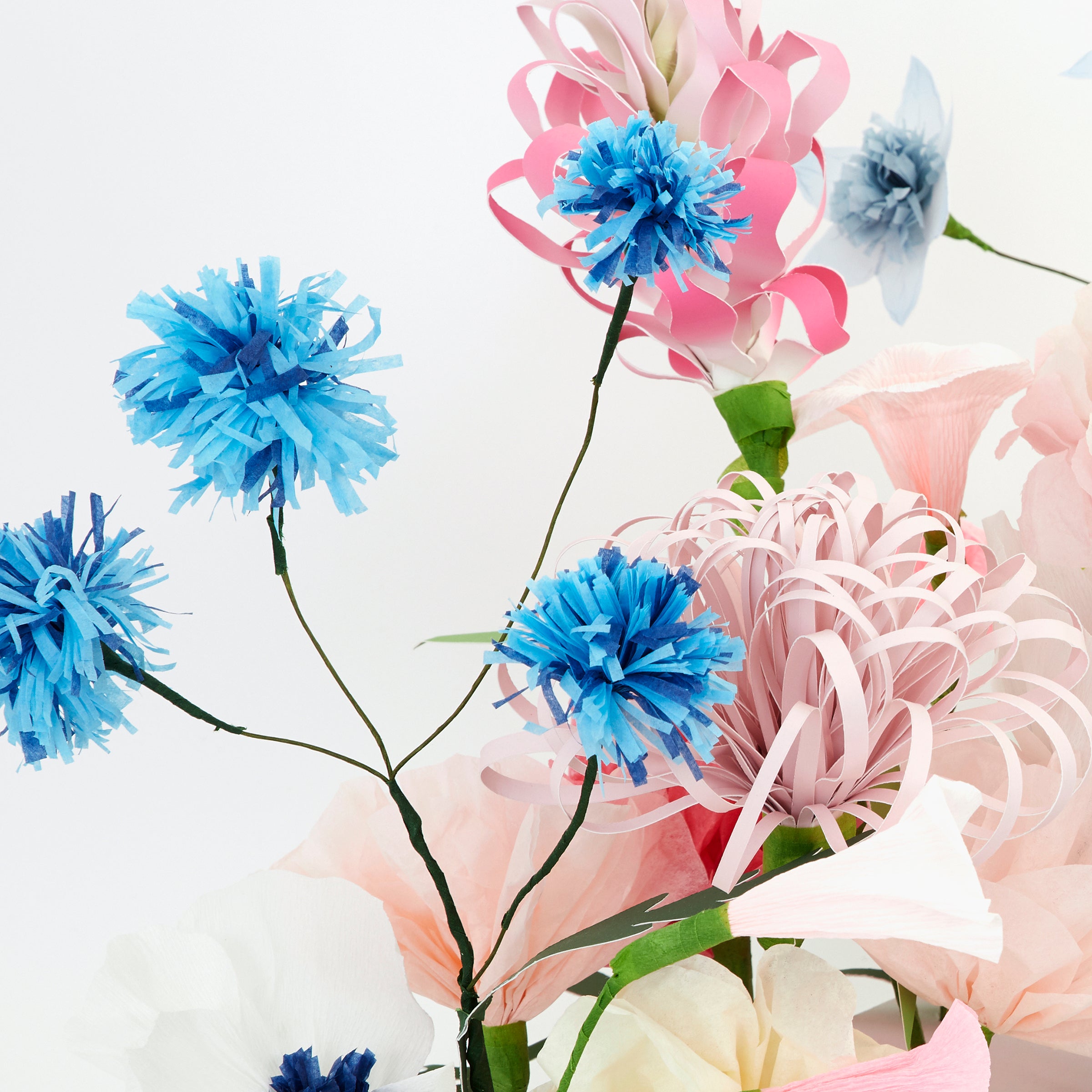 Our beautiful summer table decoration is crafted with stunning paper flowers and leaves.