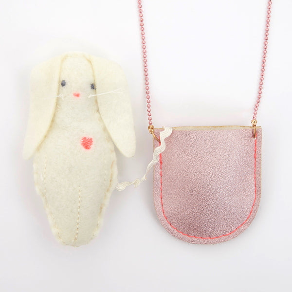 This pretty necklace features a padded felt bunny, sitting in a glittery pink leatherette pocket, with a pink bead chain. Image3