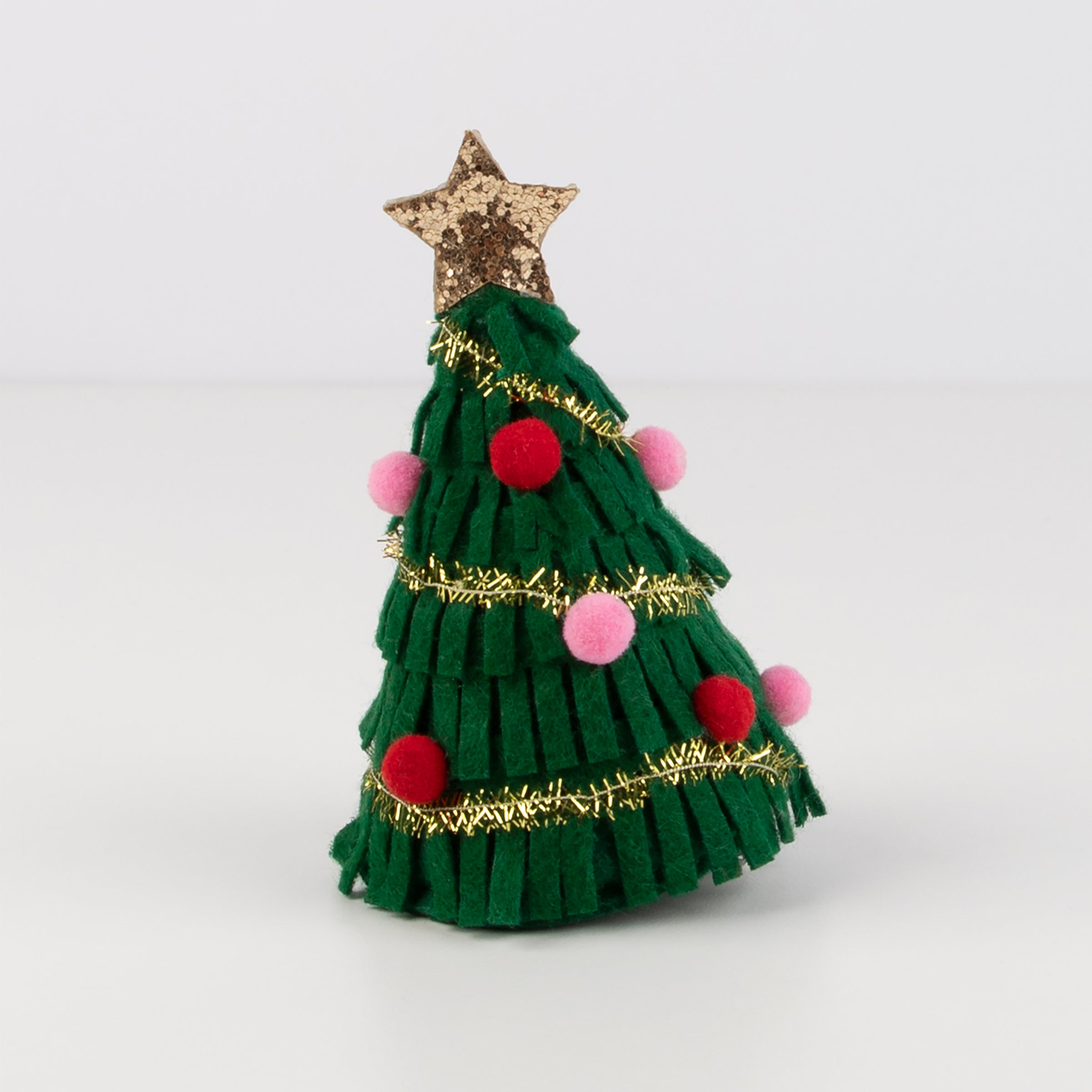 Our Christmas hair accessory is crafted from felt to look like a sparkling Christmas tree.