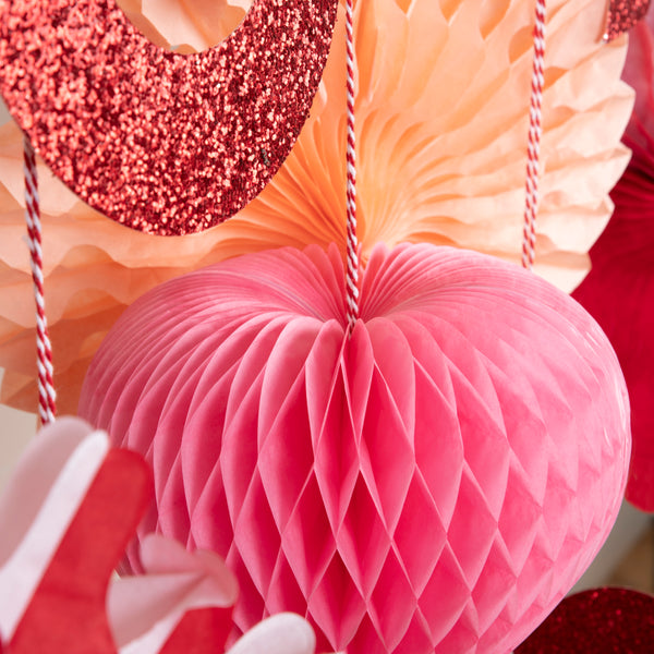 Our large heart garland features honeycomb and glitter hearts. Image5