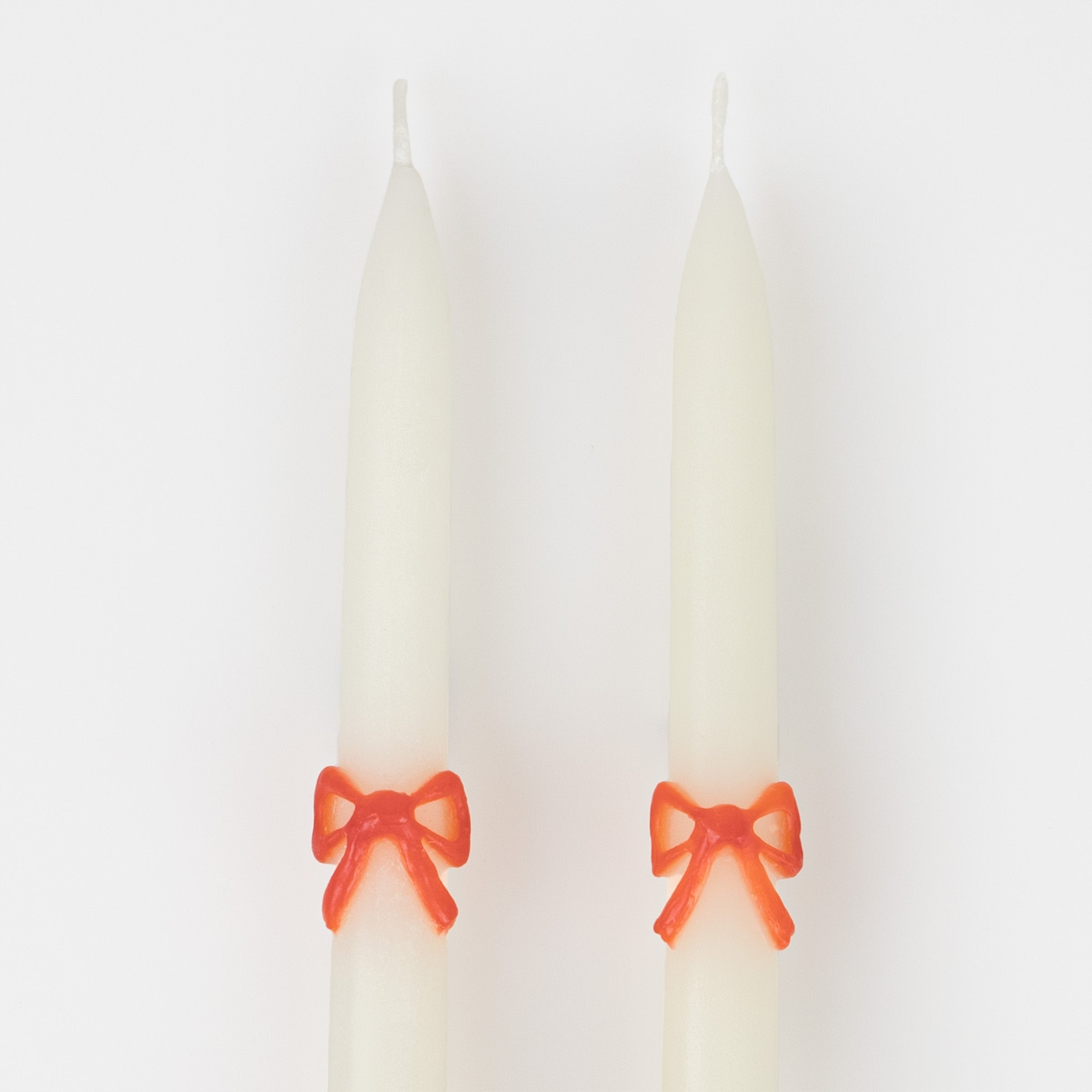 Our taper candles, with a bow design, are perfect as Christmas decorative candles.