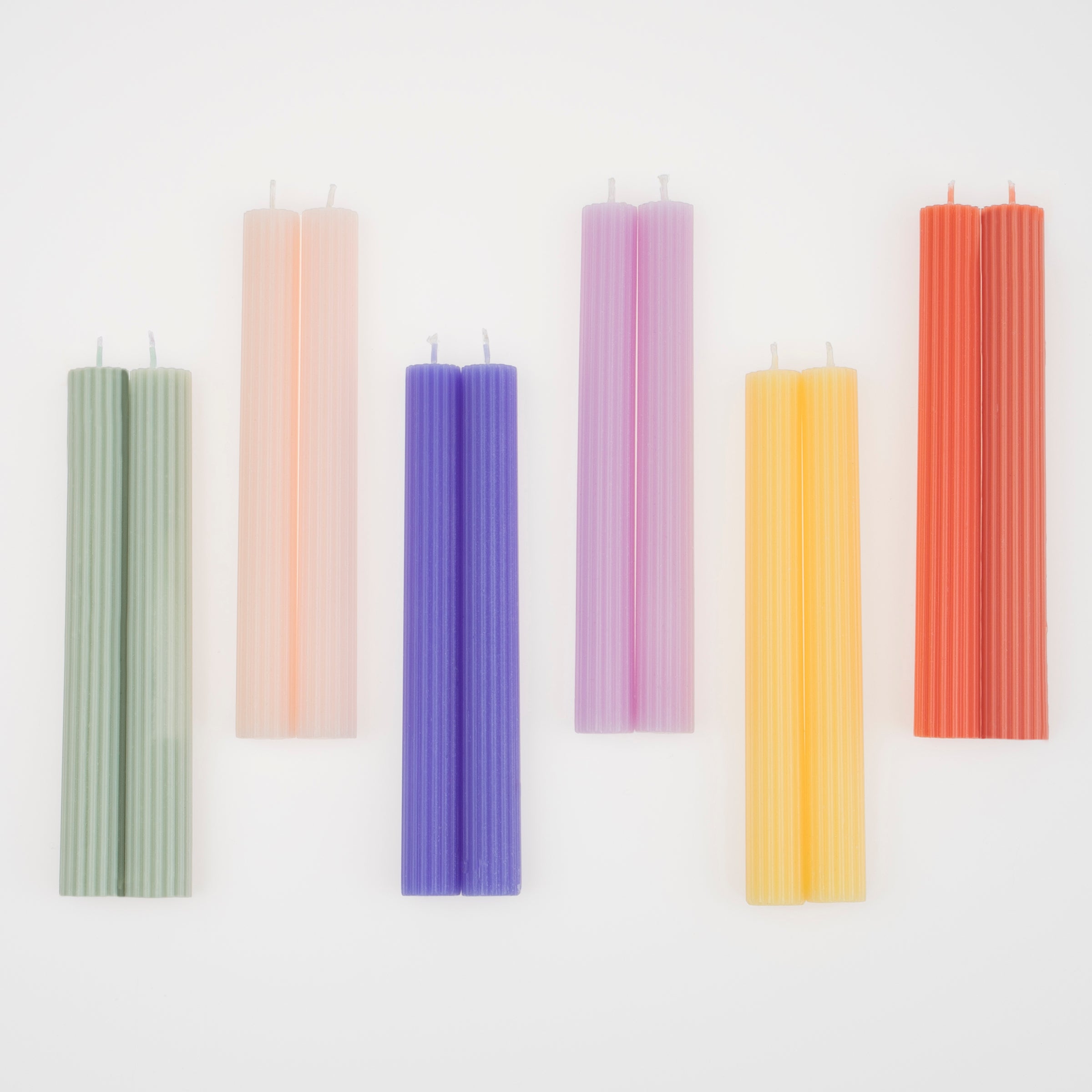Our decorative candles in coral, pink, blue, sage and yellow will add colour to your party table.